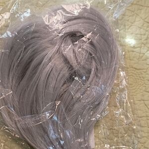 Silver Hair Wig Extension with Silky Texture, gathered on secure Rubber Band.